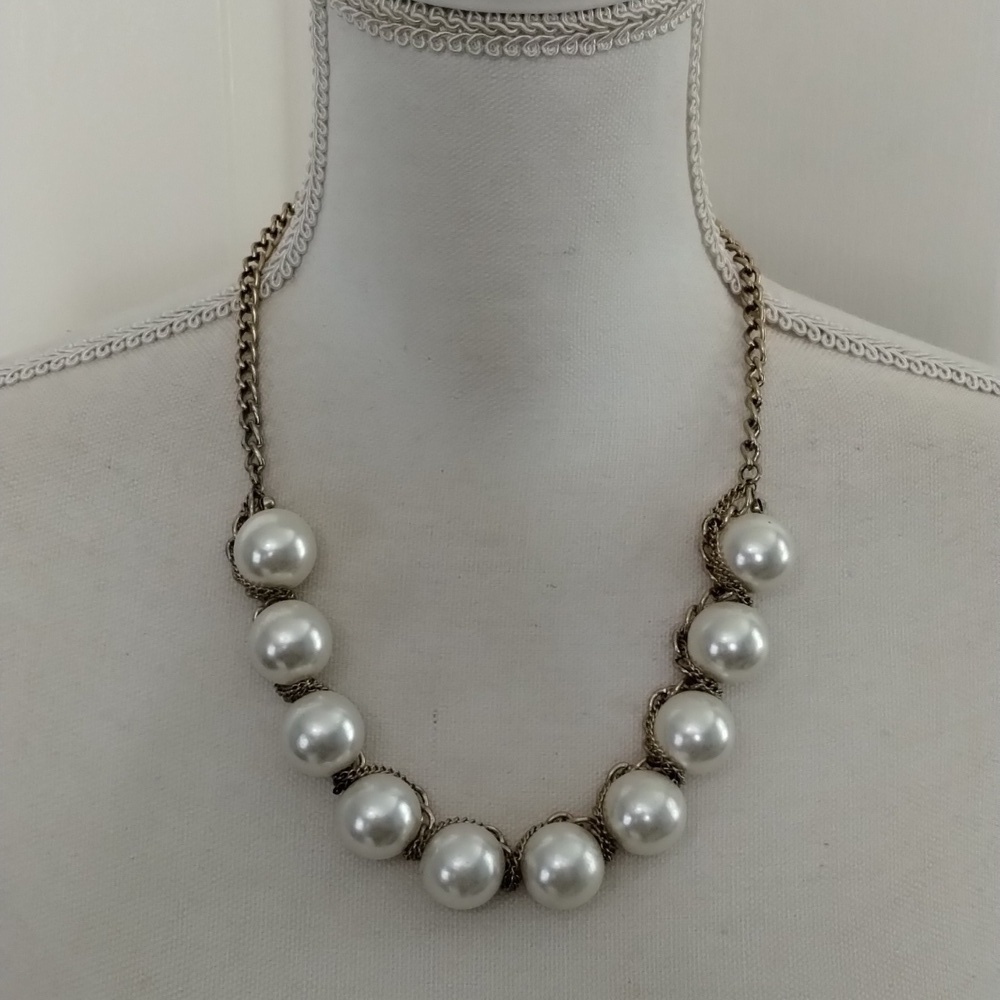 Women's white pearl beaded necklace wrapped in gold tone chain